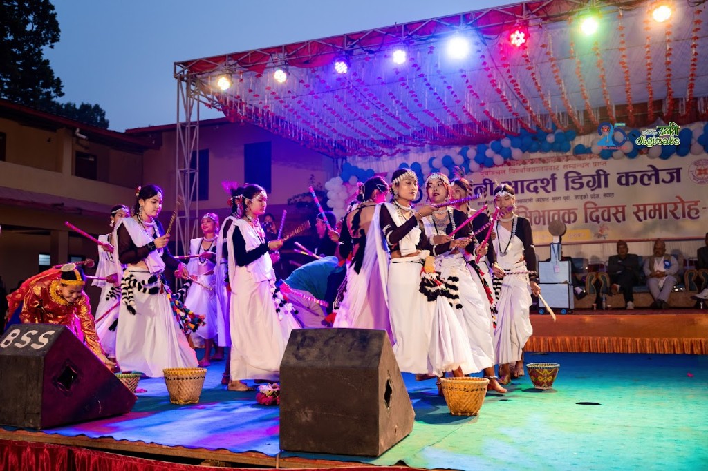 Students performing a cultural dance on the college stage
